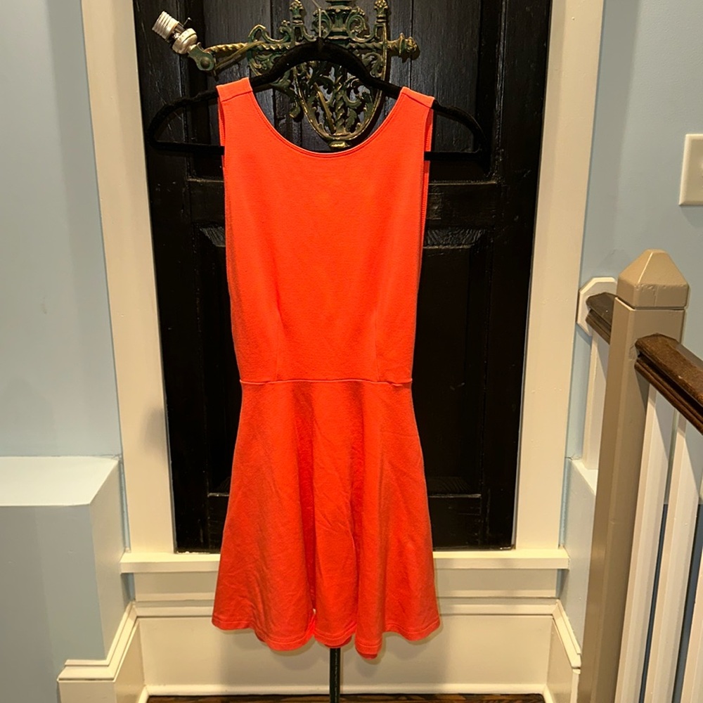 Orange knee length open back and sides dress